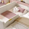 A close-up view of a children's bed with pink accents and a tan blanket. Podgląd zdjęcia produktu