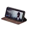 A brown flip cover case for a smartphone, with the phone displaying a movie poster. Produktbild-Vorschau