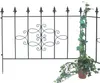 A black metal fence panel with decorative scrollwork and a potted ivy plant next to it. Náhľad obrázku produktu