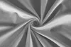 A close-up, swirled view of gray velvet fabric. Produktbild-Vorschau