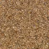 A close-up, top-down view of a pile of flax seeds. Podgląd zdjęcia produktu