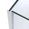 A close-up view of a shower door seal attached to a glass shower door, with water droplets on the seal and glass. Podgląd zdjęcia produktu