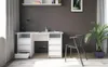 A white desk with drawers and a chair in a room. Produktbild-Vorschau