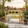 A wooden garden bench in a blooming garden setting. Anteprima dell’immagine prodotto