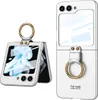 A white flip phone case with a gold ring holder is shown next to a partially opened flip phone in a similar case. Produktbild-Vorschau