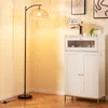 A floor lamp and a cabinet are shown in a room. Podgląd zdjęcia produktu