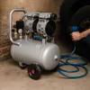 An air compressor is being used to inflate a car tire. Anteprima dell’immagine prodotto