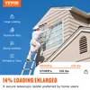 A person is painting the exterior of a house while standing on a telescopic ladder. Anteprima dell’immagine prodotto