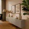 Living room scene with a wall-mounted cabinet and decor. Produktbild-Vorschau