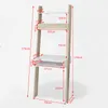 A ladder-style bookshelf with an integrated desk, showing various dimensions and measurements. Podgląd zdjęcia produktu