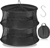 A black, multi-tiered drying net with a hook and a folded carrying bag. Náhľad obrázku produktu