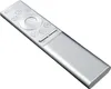 A silver remote control is shown against a white background. Náhľad obrázku produktu