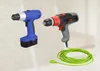 Two cordless drills are displayed against a light, neutral background. One is blue and black, and the other is red, black, and gray. A coiled green cord with a plug is visible in the foreground. Podgląd zdjęcia produktu