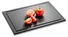 A cutting board with tomatoes and herbs on it. Podgląd zdjęcia produktu