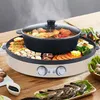 A multi-functional electric hot pot and grill with food being cooked on it, set on a wooden table. Voir les images du produit