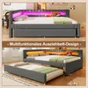 A split image showing a grey upholstered bed with LED lighting in two configurations: one as a daybed and the other with an extended trundle bed. Voir les images du produit