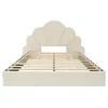 A beige upholstered bed frame with a scalloped headboard and wooden slats is shown from a front-facing, slightly elevated angle against a white background. Produktbild-Vorschau