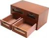 A wooden desk organizer with drawers is shown from a three-quarter angle. Podgląd zdjęcia produktu