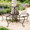 A metal garden bench wraps around a tree in a garden setting. Náhled obrázku produktu