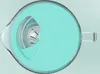 Top-down view of a turquoise pitcher lid and its transparent handle. Náhled obrázku produktu
