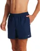 A man wearing navy blue Nike swim shorts. Podgląd zdjęcia produktu