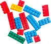 A collection of colorful building blocks scattered on a white background. Náhľad obrázku produktu