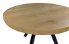 A close-up view of a round wooden table with black legs. Náhled obrázku produktu