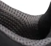 A close-up view of the interior lining of a shoe, showing a mesh fabric. Produktbild-Vorschau