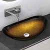 A close-up shot of a glass vessel sink with a golden and brown gradient, mounted on a dark countertop. Produktbild-Vorschau