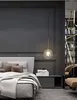 A bedroom scene with a bed, nightstand, and a hanging lamp. Anteprima dell’immagine prodotto