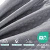 A close-up of gray fabric with a hexagonal pattern, featuring marketing icons and text. Náhľad obrázku produktu