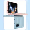 Two phone cases, one pink and one light blue, are shown in a studio setting against a light blue and white background. The pink case is open, revealing a phone screen with a colorful abstract image. The light blue case is closed and shows the back with a c Produktbild-Vorschau