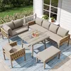 An outdoor patio set on a deck with a railing and greenery in the background. Produktbild-Vorschau