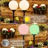 Two images showing solar garden lights in different states: charging in the sun and lit up at dusk. Produktbild-Vorschau