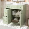 A green bathroom vanity with its doors open, displaying toiletries and towels. Anteprima dell’immagine prodotto