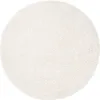 A round, cream-colored rug is shown from a top-down perspective on a white background. Voir les images du produit