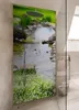 A shower enclosure with a decorative panel depicting a stream and flowers. Produktbild-Vorschau