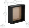 A black shadow box frame with dimensions indicated by measurement lines and circles. Produktbild-Vorschau