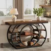 A console table with shelves is placed behind a sofa in a living room, next to a fireplace. Náhľad obrázku produktu