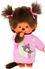 A plush toy Monchhichi doll wearing a pink pajama top with a moon and star design. Produktbild-Vorschau