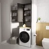 A laundry room with a washing machine and a tall cabinet for storage. Anteprima dell’immagine prodotto