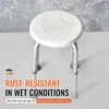 A white shower stool with adjustable legs against a textured gray background. Produktbild-Vorschau