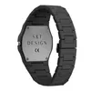 The back of a black watch with a metal plate showing brand information. Produktbild-Vorschau