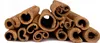 A pile of dried cinnamon sticks against a white background. Produktbild-Vorschau