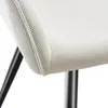 A close-up view of a cream-colored chair with a ribbed texture and black legs. Produktbild-Vorschau