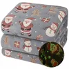 A stack of folded blankets with a Christmas theme, featuring Santa Claus, snowmen, gingerbread men, and reindeer. Náhled obrázku produktu