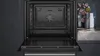 An open built-in oven with the interior visible. Produktbild-Vorschau