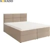 A studio shot of a beige boxspring bed with a headboard and mattress. Produktbild-Vorschau