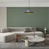 A modern living room scene with a sectional sofa, coffee tables, and a pendant light. Produktbild-Vorschau