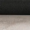 A close-up view of the underside and texture of a beige rug. Produktbild-Vorschau